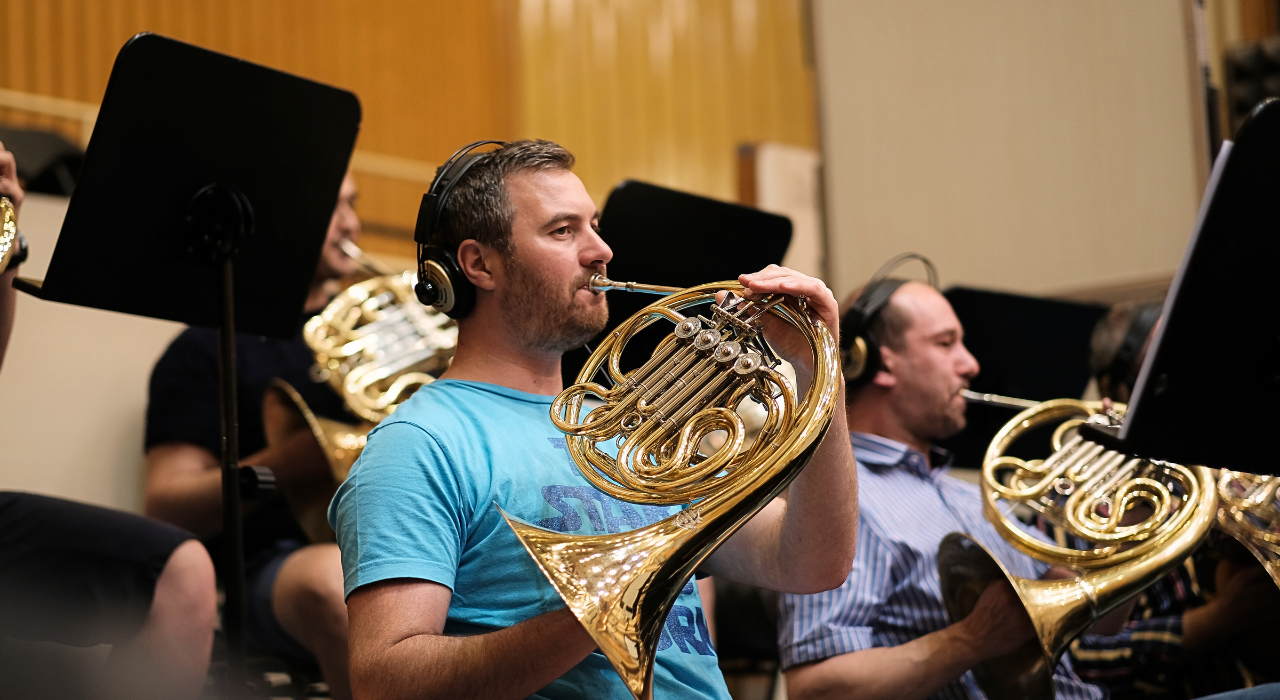 Horn Player in Recording Session